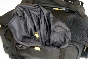 The removable rain cover tucks nicely in a pocket under the bag. 