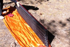 Big Agnes Air Core pad seen in relation to a Marmot Home Alone Bivy tent. It fit fine.