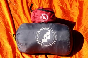 Big Agnes (BA) Air Core in stuff sack and BA Yampa sleeping bag show compact relationship. Both fit into Osprey Xenon lower sleeping bag compartment with room to spare.