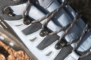 Heavy plastic lacing loops are durable enought to handle lots of abuse and scrapes over rocks. The upper lace loops are metal. 