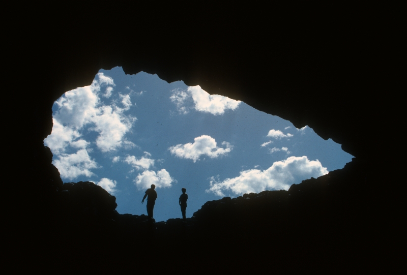 Visitors standing in lava tube