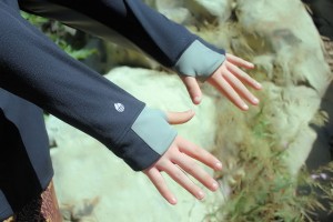 Elongated sleeves and thumbholes protect the top of hands from sun