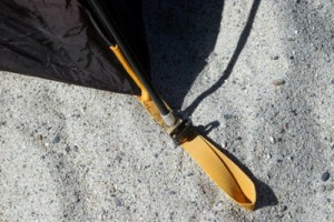 The poles slip into the foot lanyards of the tent which also have clasps for attaching and securing the rainfly. 